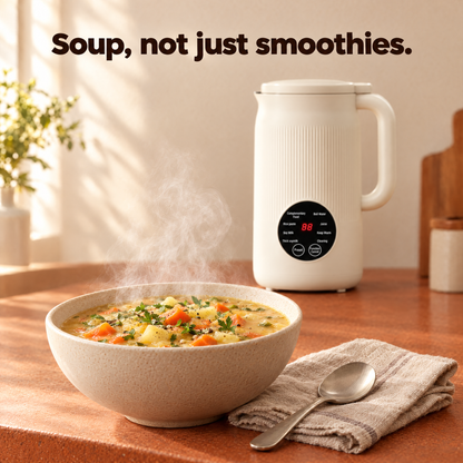 Bowl of thick hot vegetable soup made in the machine, with spoon and linen napkin